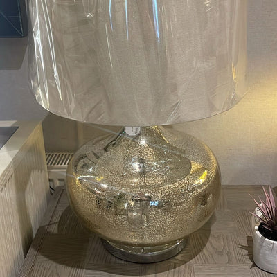 Hill Table lamp with shade in a gentle gold finish.