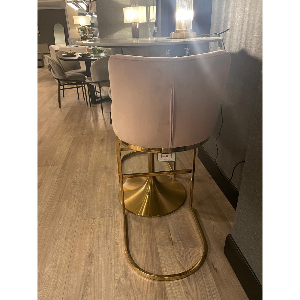 Bolton K velvet counter bar stool in pink with a gold/brass frame and round base.