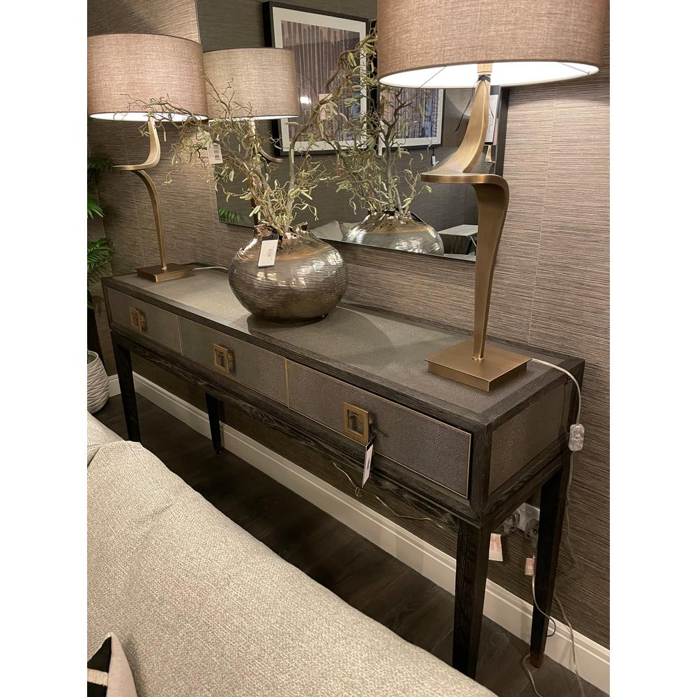 Kensington 3-drawer console table with faux shagreen top, black oak frame, and geometric gold handles, styled with lamps.