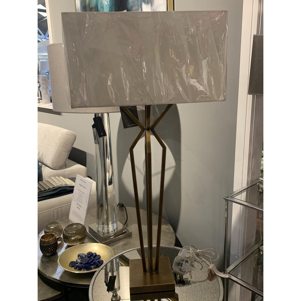 Victoria designer table lamp with antique brass finish metal base and rectangular shade.