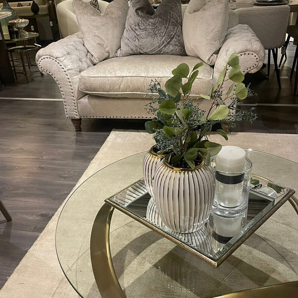 Soquel round coffee table by Eichholtz in vintage brushed brass..