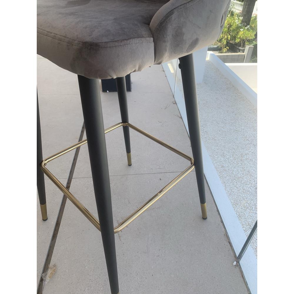 Airmani khaki velvet bar stool with black metal legs and gold footrest.
