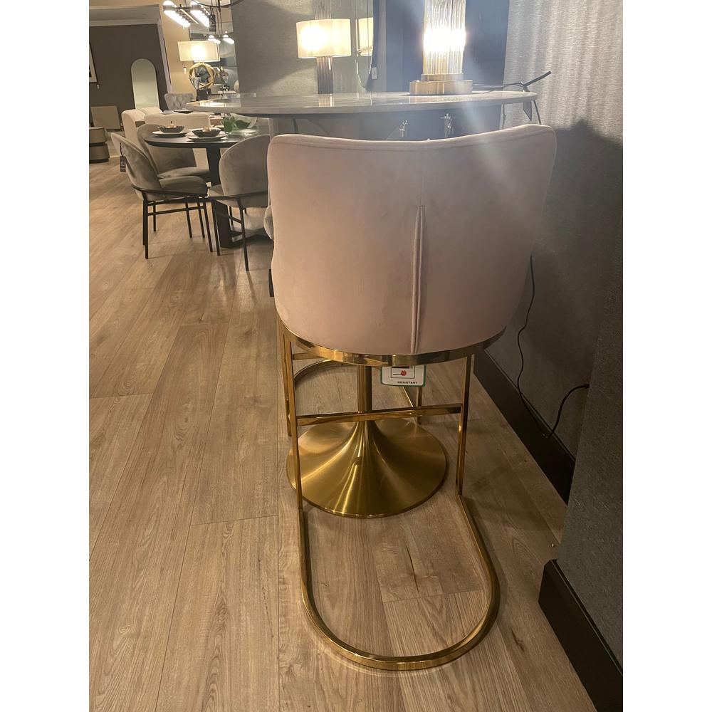 Pink Bolton K Velvet Counter bar stool with a gold/brass frame.