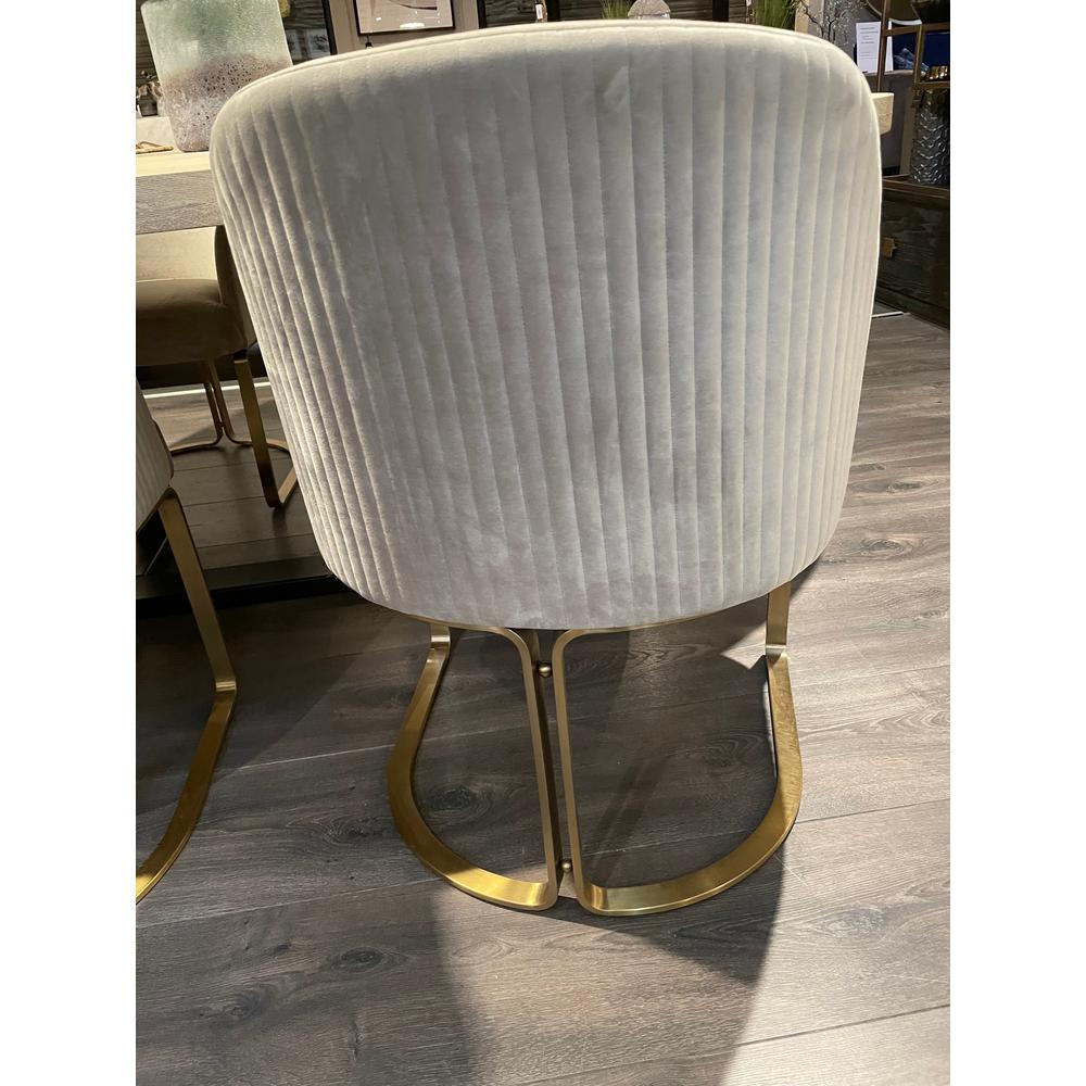 Camden Club dining chair, stone velvet with vertical channel tufting and brushed gold U-shaped base.