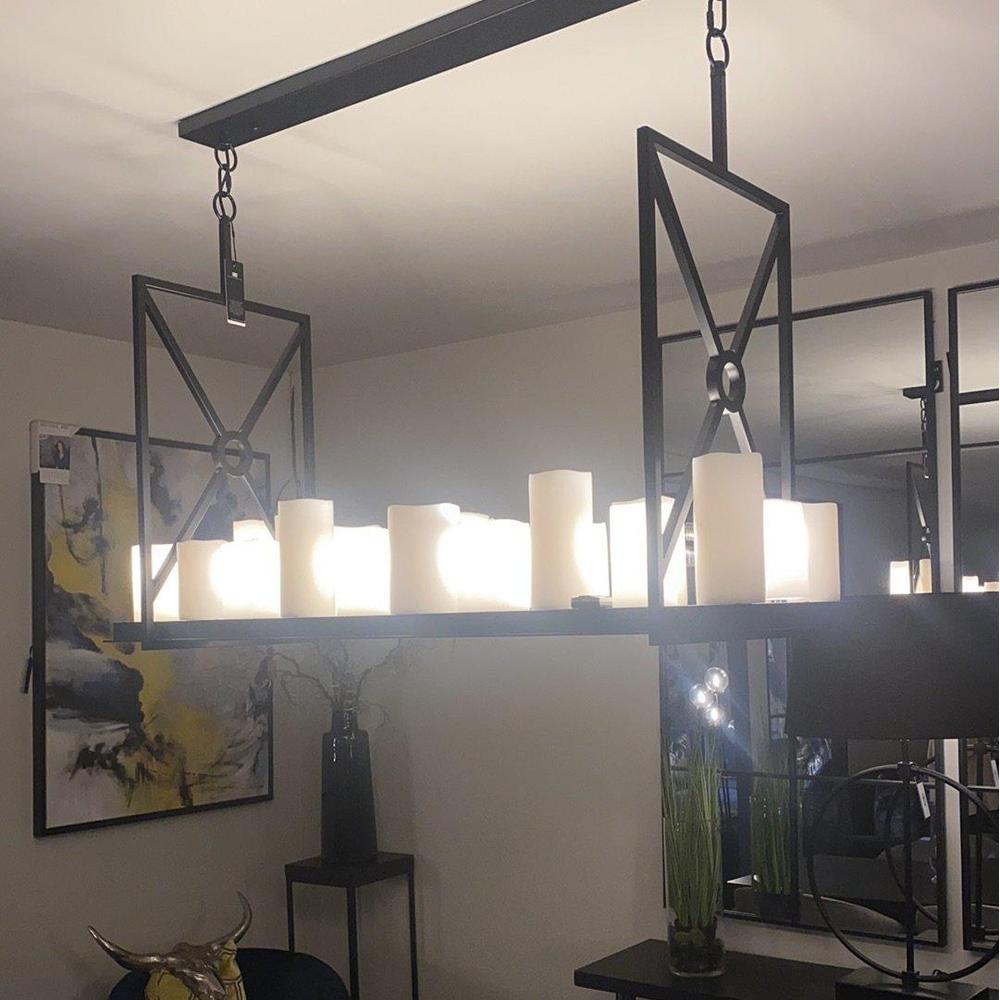 Eichholtz Commodore black chandelier with 22 faux pillar candles and 4 LED downlights.