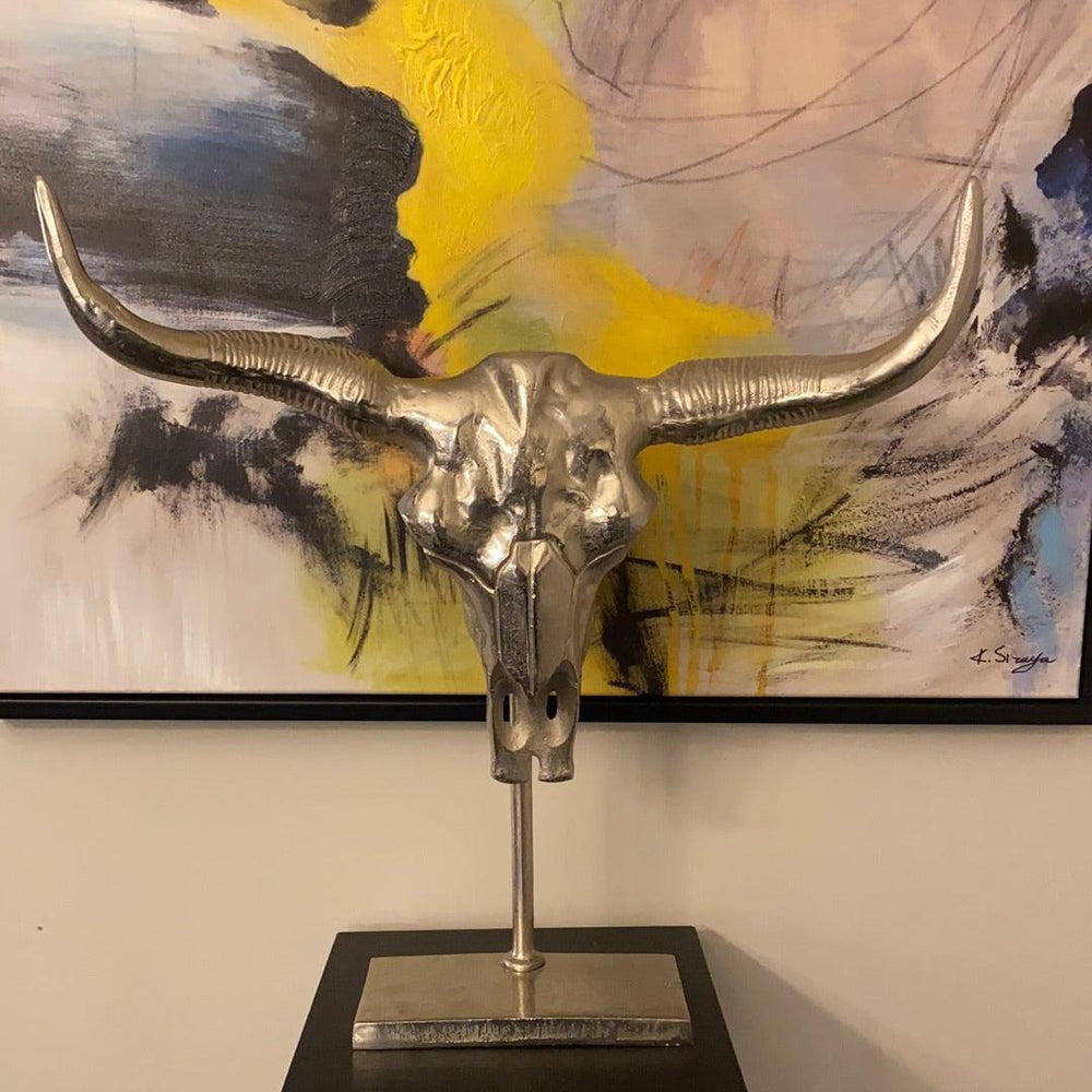 Manhattan Silver Bull skull on black stand