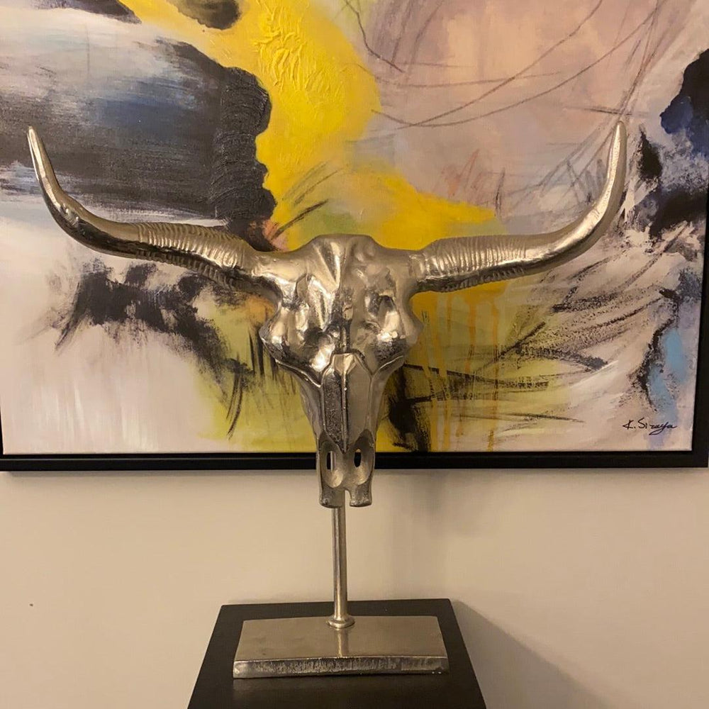 Manhattan Silver Bull skull on black stand