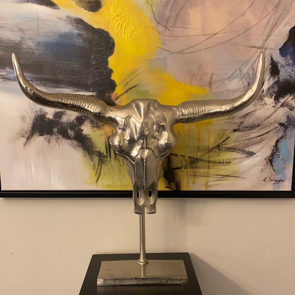 Manhattan Silver Bull skull on black stand