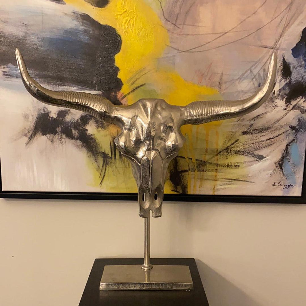 Manhattan Silver Bull skull on black stand