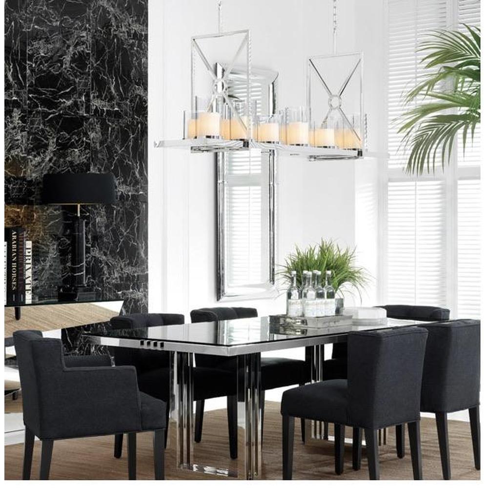 Summit polished steel chandelier with clear glass shades over a dining table.