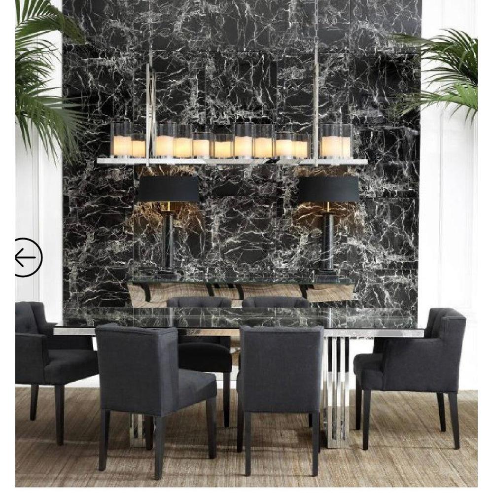 Summit polished steel chandelier by Eichholtz with clear glass shades and LED spots, above a dining table.