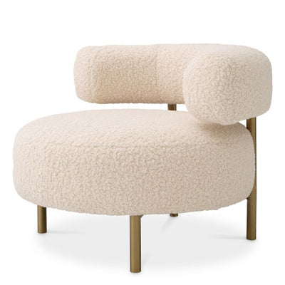 Thompson Occasional chair by Eichholtz in faux shearling or Lyssa sand