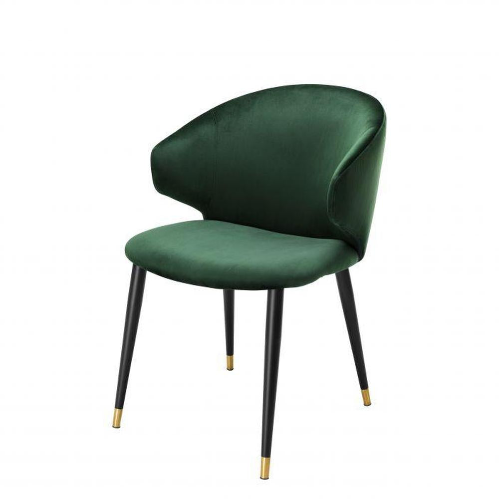 Volante Luxury Dining Chair with dark green velvet upholstery, black tapered legs, and brass caps.