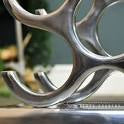 Wine rack in silver polished aluminium-Renaissance Design Studio