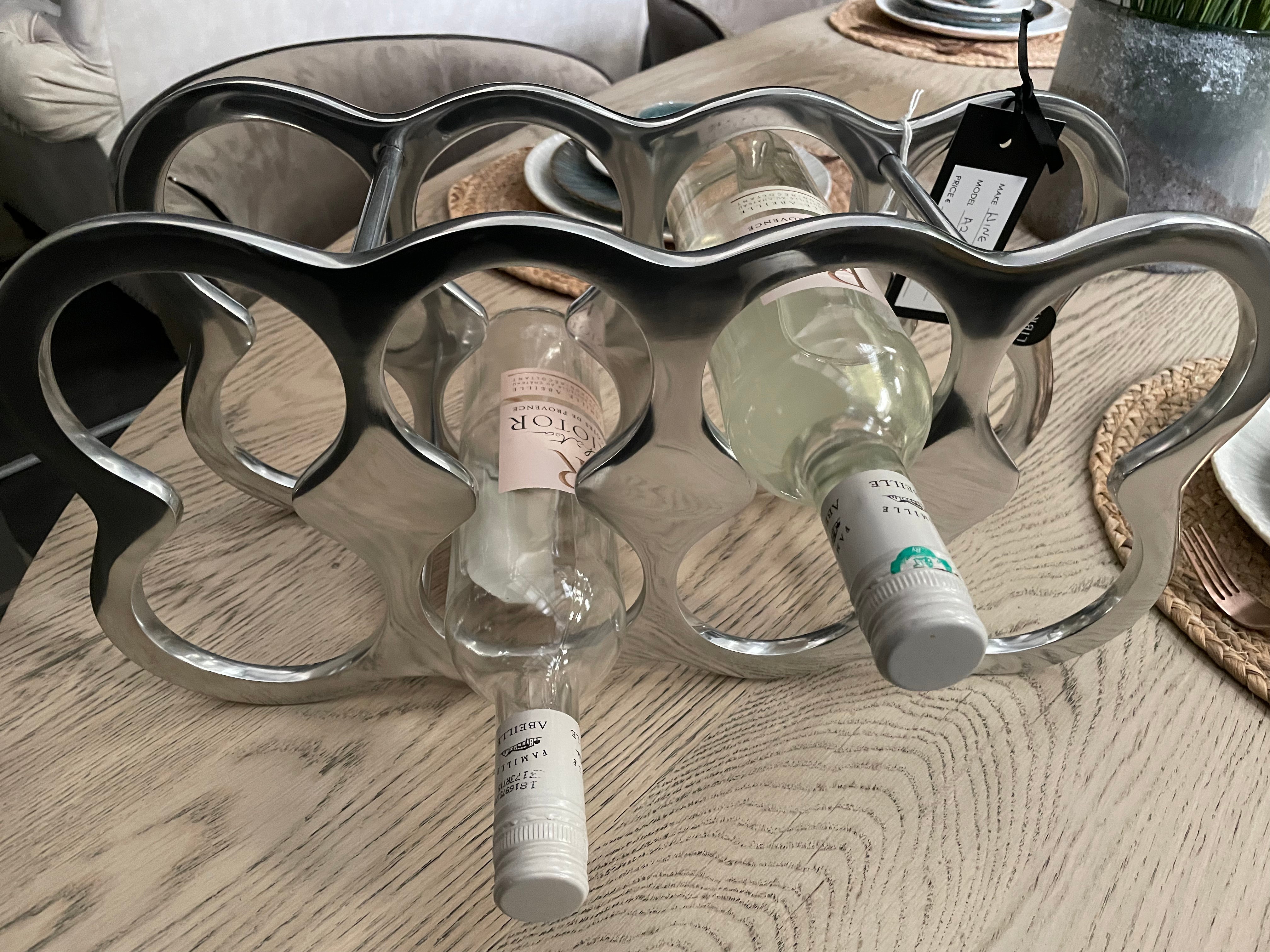 Wine rack in silver polished aluminium-Renaissance Design Studio